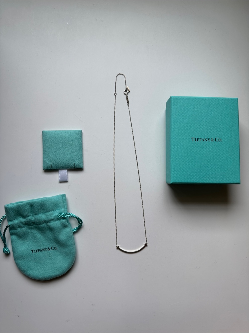 Tiffany & Co. Sterling Silver Smile Bar Necklace with Tiffany Blue Pouch and Box